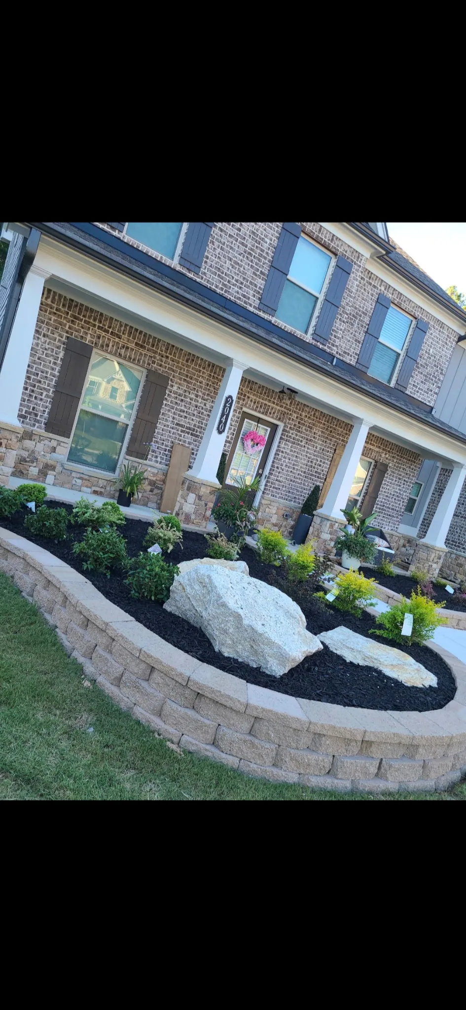 Raised flower bed built and landscaped by E&D Landscaping